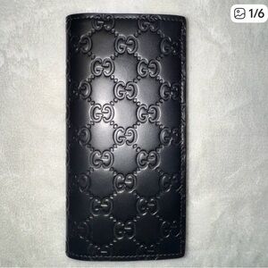 Gucci Black GG Embossed Wallet